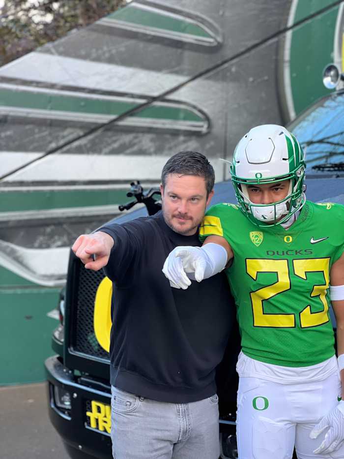 Marco Jones poses with head coach Dan Lanning during a trip to Eugene.